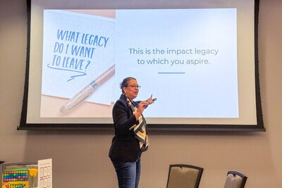 a presenter points to a slideshow