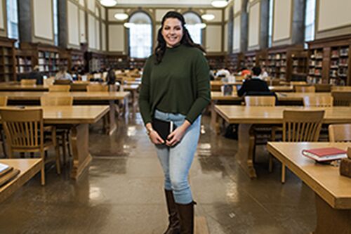 Edith Munoz poses in the Main Library at the University of Illinois