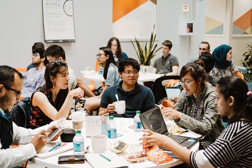Students at iVenture discuss their startup