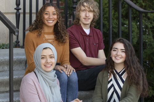 Jason Smith (back right) poses with other students from the Department of History, including Yasmeen Ragab, Johnna Jones, and Carmen Gutierrez.