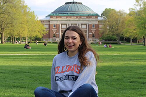 Elena sits on the Main Quad