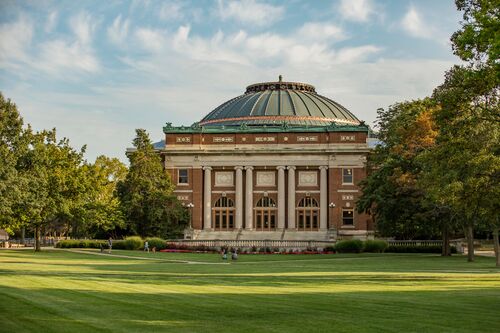 Photo of Foellinger Auditorium with a bright blue sky in the background.