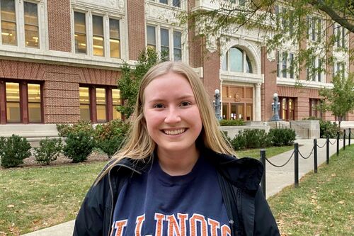 LAS student poses for photo on the Quad in an Illinois sweatshirt