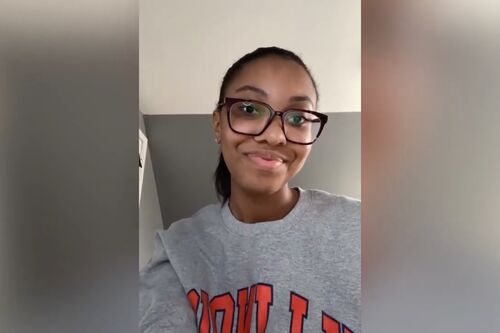 LAS student records video in a gray Illinois sweathshirt