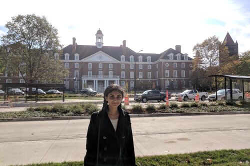 LAS student poses for photo in front of the student union