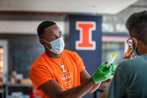 Worker explains saliva test