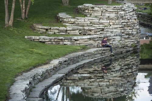 A student reads new Boneyard Creek