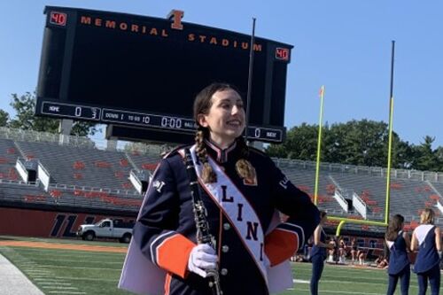 Student in Marching Illini uniform at Memorial Stadium