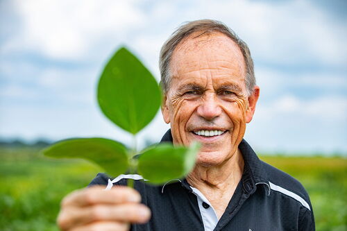 Stephen Long holds a plant