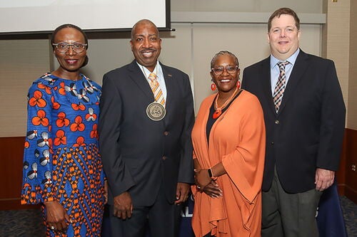 Group photo at Travis Dixon investiture ceremony