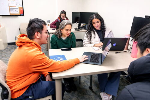 Students and professor in experiential learning lab