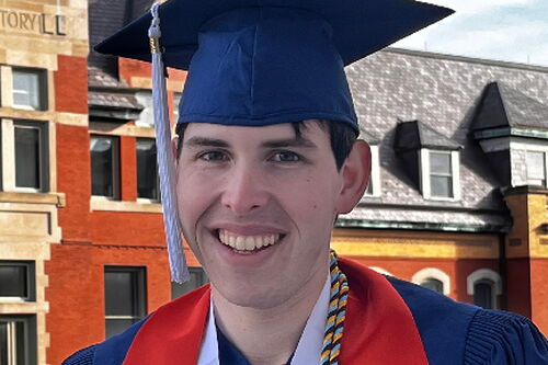 GGIS alum Jason Segal in his blue cap and gown for graduation