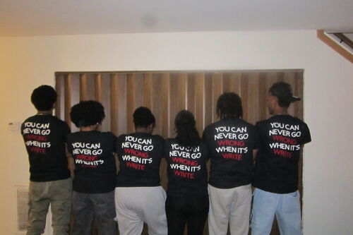students with their backs to the camera, the back of their t-shirts reading "you can never go wrong when it's write"