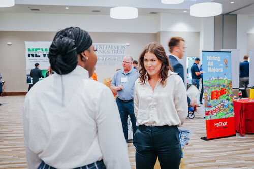 Student and a recruiter talking at the LAS career fair