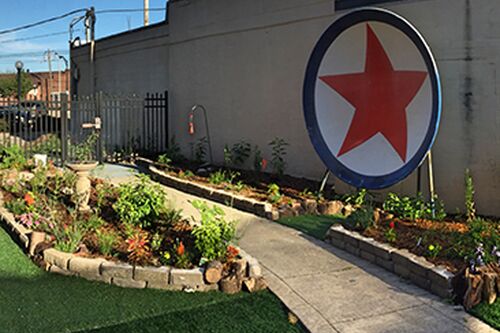 Students help open butterfly garden, archaeology exhibit at children's museum