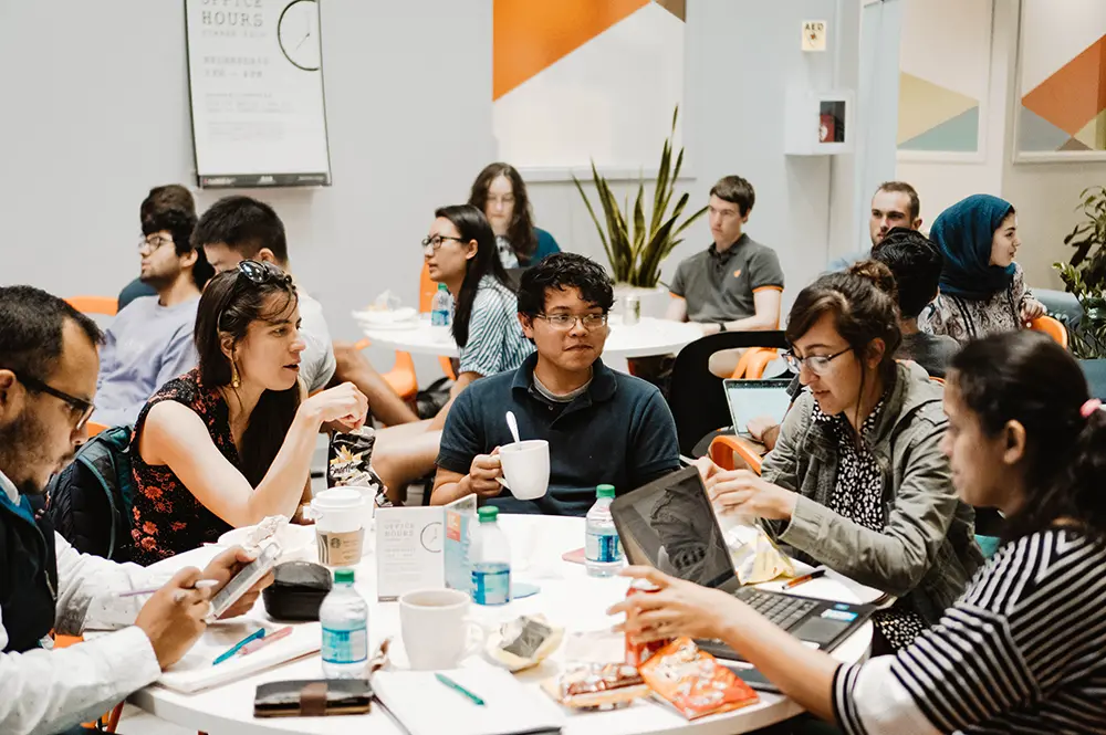 Students at iVenture discuss their startup