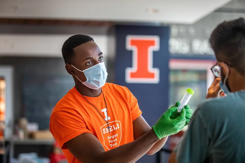Worker explains saliva test
