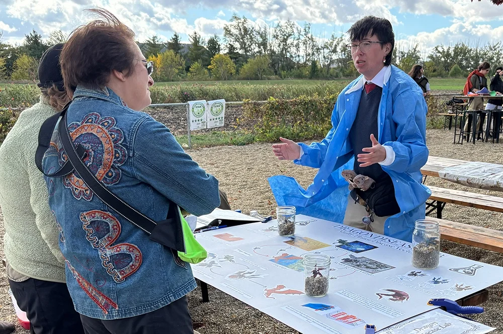 Student speaks to attendees at Dragon Expo