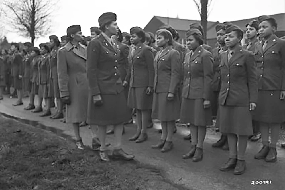 Major Charity E. Adams and Captain Mary Kearney inspect members of the 6888th Central Postal Directory Battalion in England on February 15, 1945