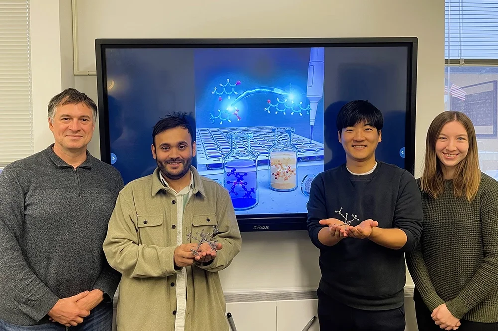 Researchers pose for a photo in the laboratory
