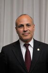 A. Mark Neuman