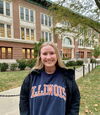 LAS student poses for photo on the Quad in an Illinois sweatshirt