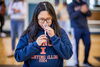Woman providing saliva sample for COVID-19 testing