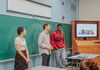 Students in the School of Literatures, Languages, Cultures, and Linguistics give a presentation in a classroom in front of a screen