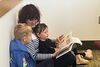 Children and a parent reading a book
