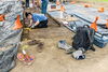 Alumna Christian Hasler works at an excavation site