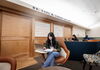 Student sitting in chair in a study space with their laptop open. 