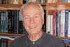 Bob Byars in front of bookshelf