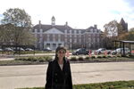 LAS student poses for photo in front of the student union