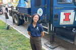 Alyssa Shih in front of a weather truck on the UIUC campus
