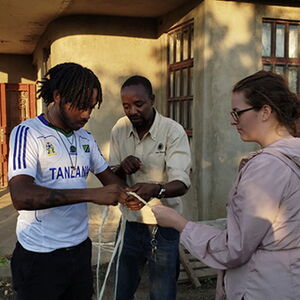 Robert Whitmore IV learns to make rope of sisal plant during a study abroad experience in Arusha, Tanzania