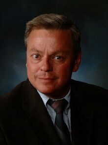 Headshot of biochemistry professor Steve Silgar in a suit